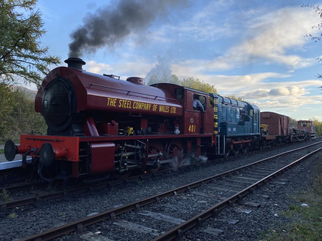 No 401 and 08915 double head a freight train leaving Percy Main.